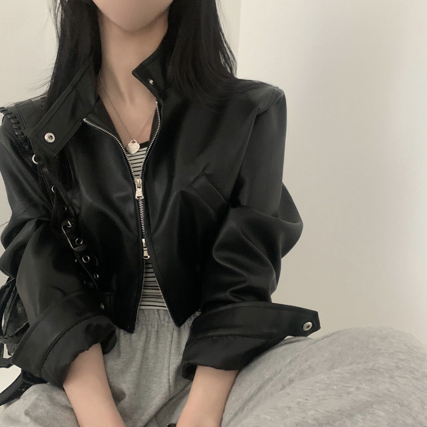 French retro design biker leather jacket for women with zip, stand collar, elastic waist and short cut