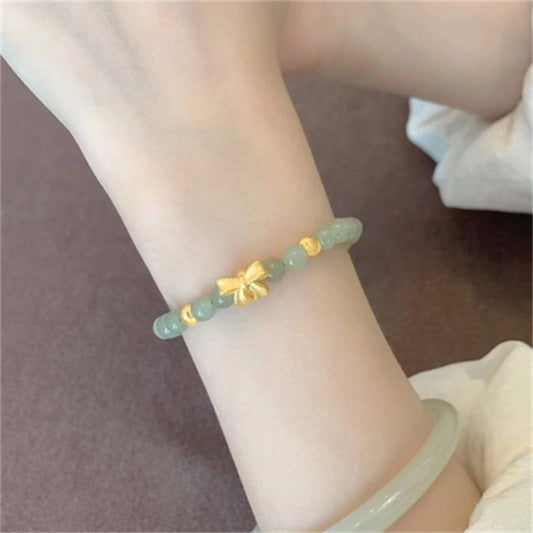 Lazo de oro de 14k y pulsera Tian Qingyu.