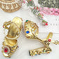 Goldene Barock High Heel Sandaletten mit Spiegelglanz