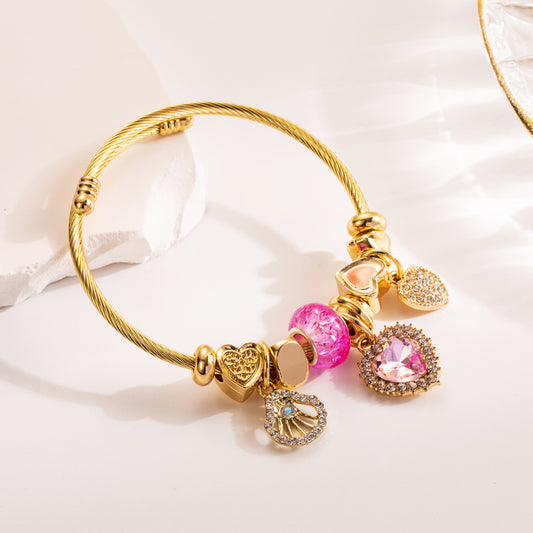 Brazalete de acero inoxidable y titanio dorado.