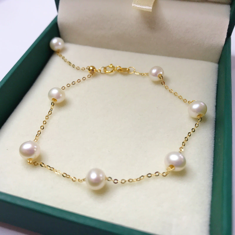 Pulsera de perlas de oro de 18 quilates: elegancia y lujo atemporales 