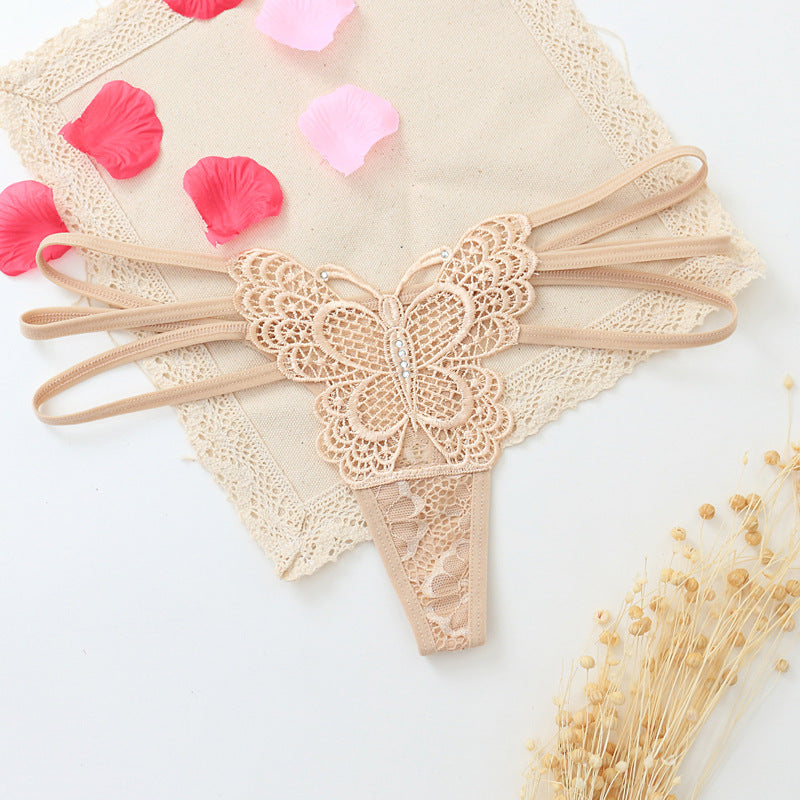 Seductive women's T-back made of delicate lace with cut-outs
