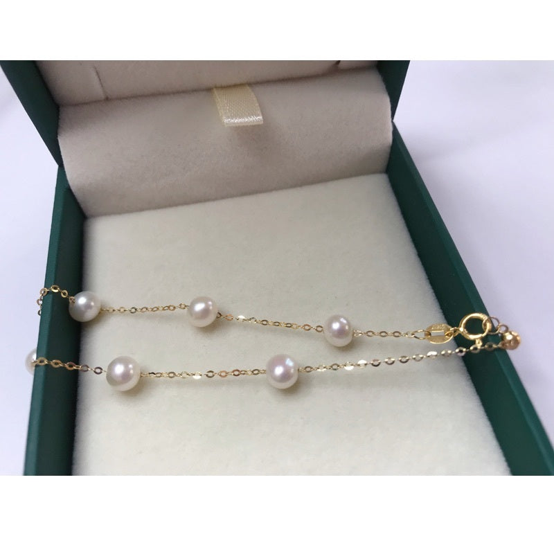 Pulsera de perlas de oro de 18 quilates: elegancia y lujo atemporales 