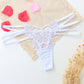 Seductive women's T-back made of delicate lace with cut-outs