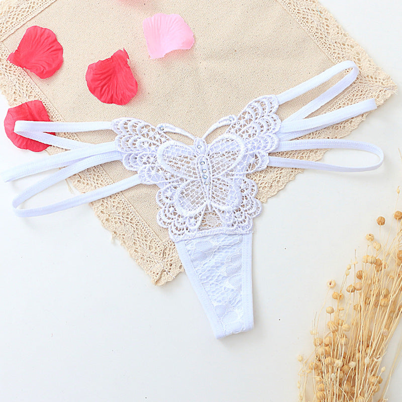 Seductive women's T-back made of delicate lace with cut-outs