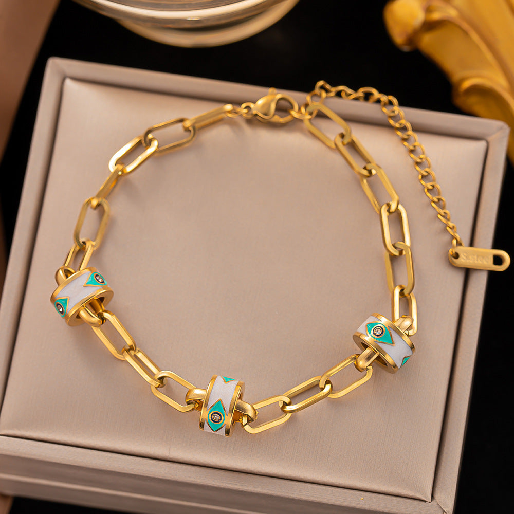 Pulsera de acero de titanio: simple, elegante y chapada en oro con acabado lacado 
