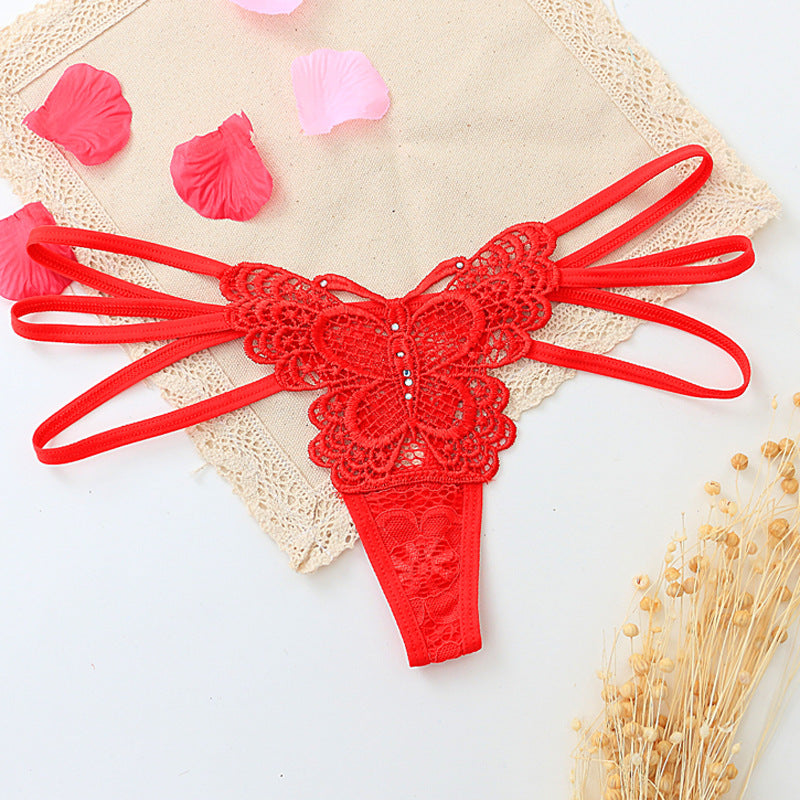Seductive women's T-back made of delicate lace with cut-outs