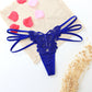 Seductive women's T-back made of delicate lace with cut-outs